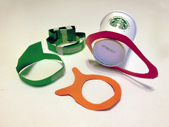 folded and taped pieces of paper in various shapes